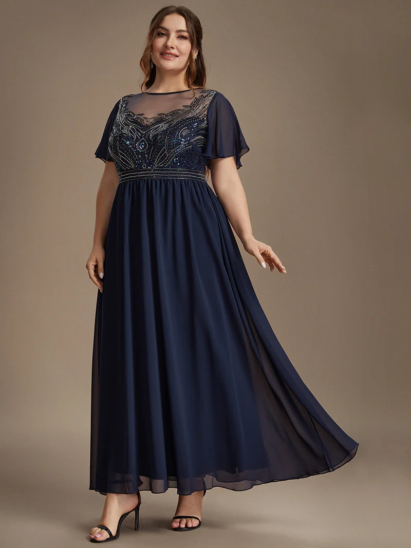 Robe longue en tulle perlée à coupe trapèze et manches volantées