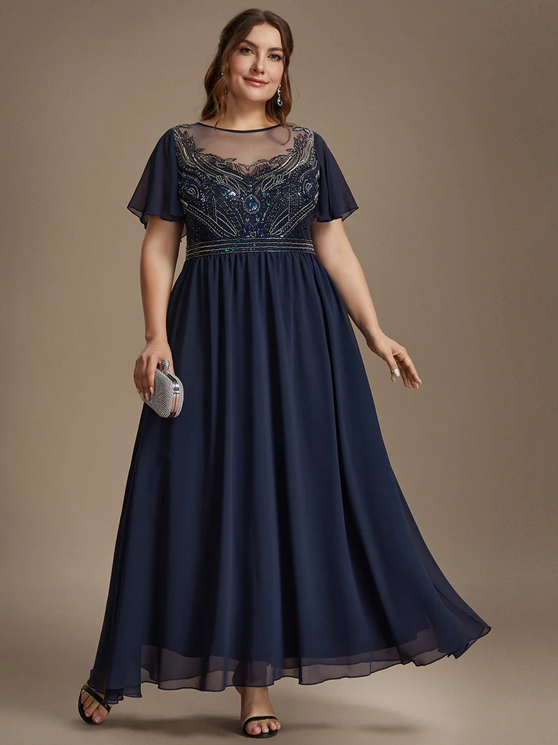 Robe longue en tulle perlée à coupe trapèze et manches volantées