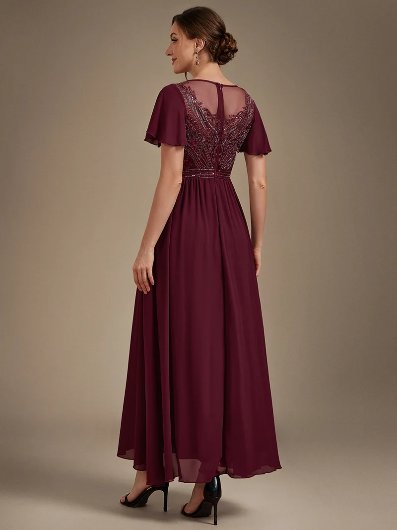 Robe longue en tulle perlée à coupe trapèze et manches volantées