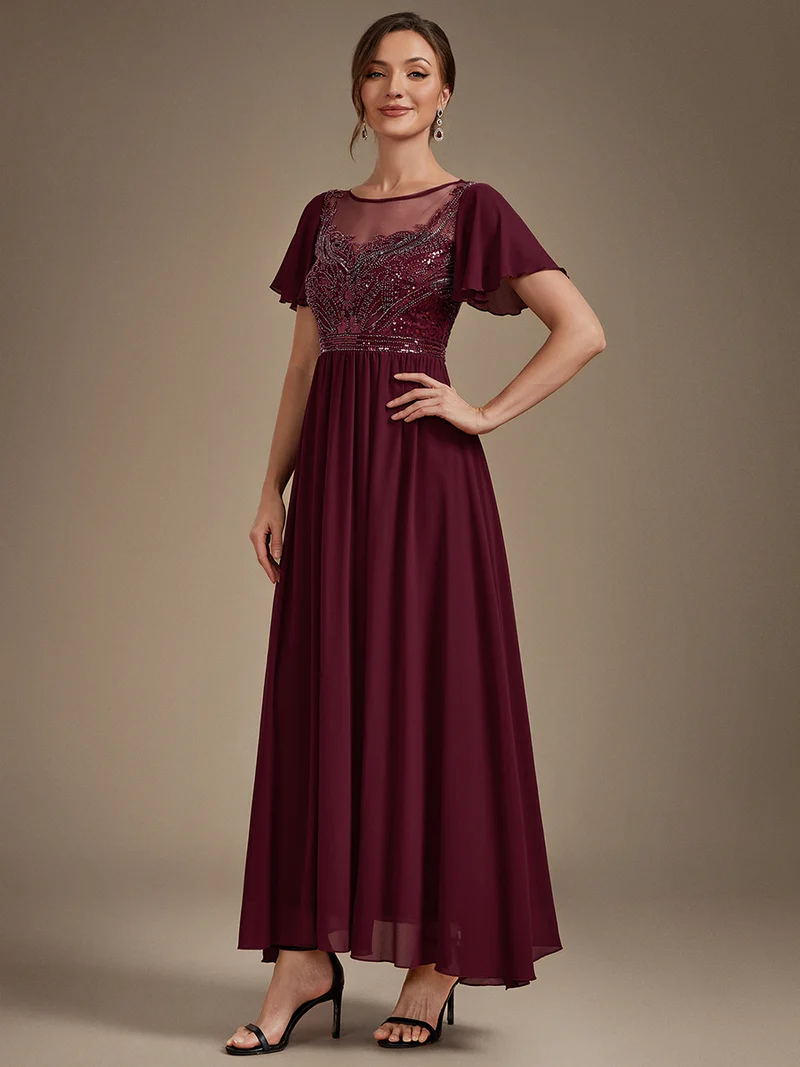 Robe longue en tulle perlée à coupe trapèze et manches volantées