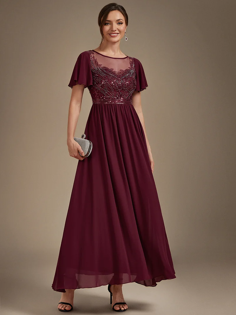 Robe longue en tulle perlée à coupe trapèze et manches volantées