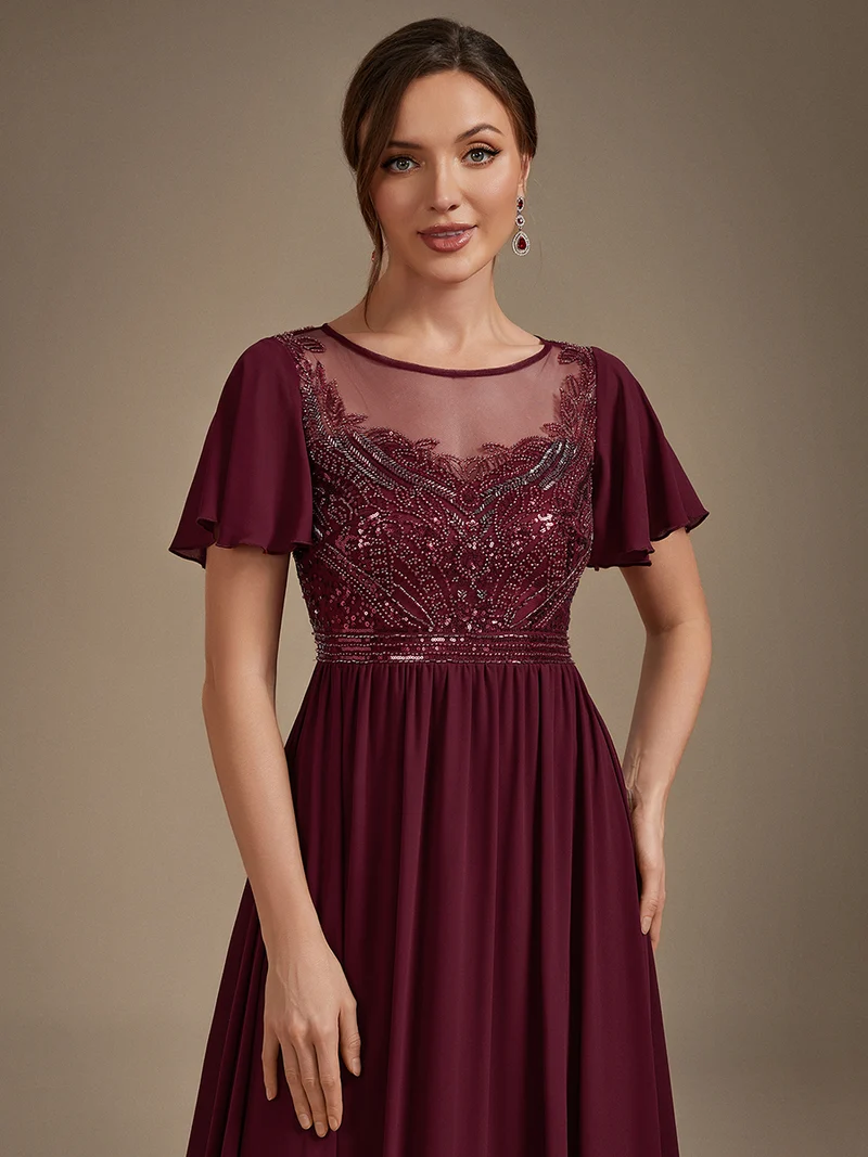 Robe longue en tulle perlée à coupe trapèze et manches volantées