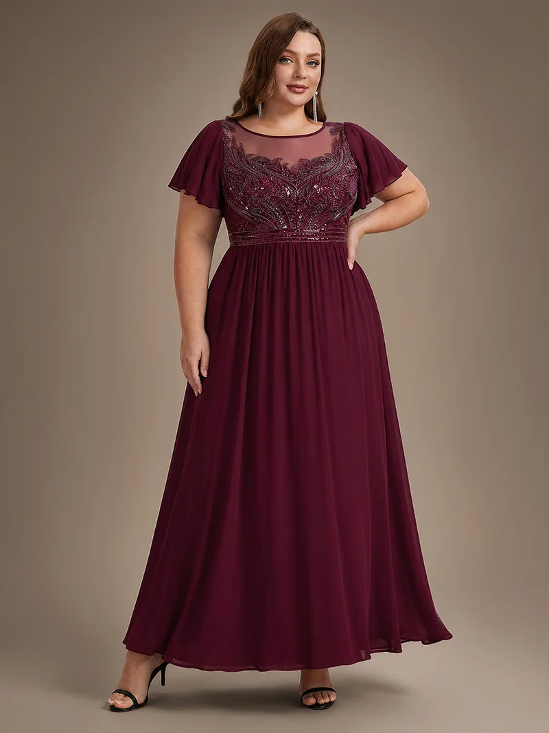 Robe longue en tulle perlée à coupe trapèze et manches volantées