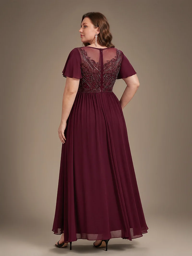 Robe longue en tulle perlée à coupe trapèze et manches volantées