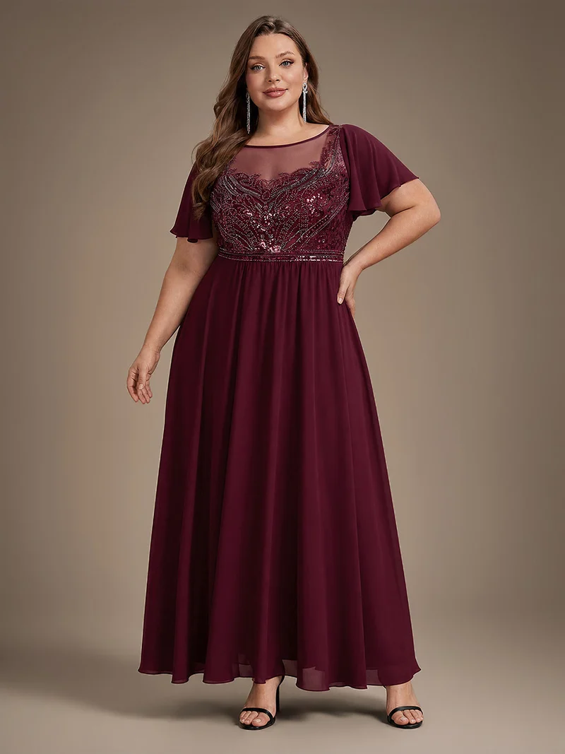 Robe longue en tulle perlée à coupe trapèze et manches volantées