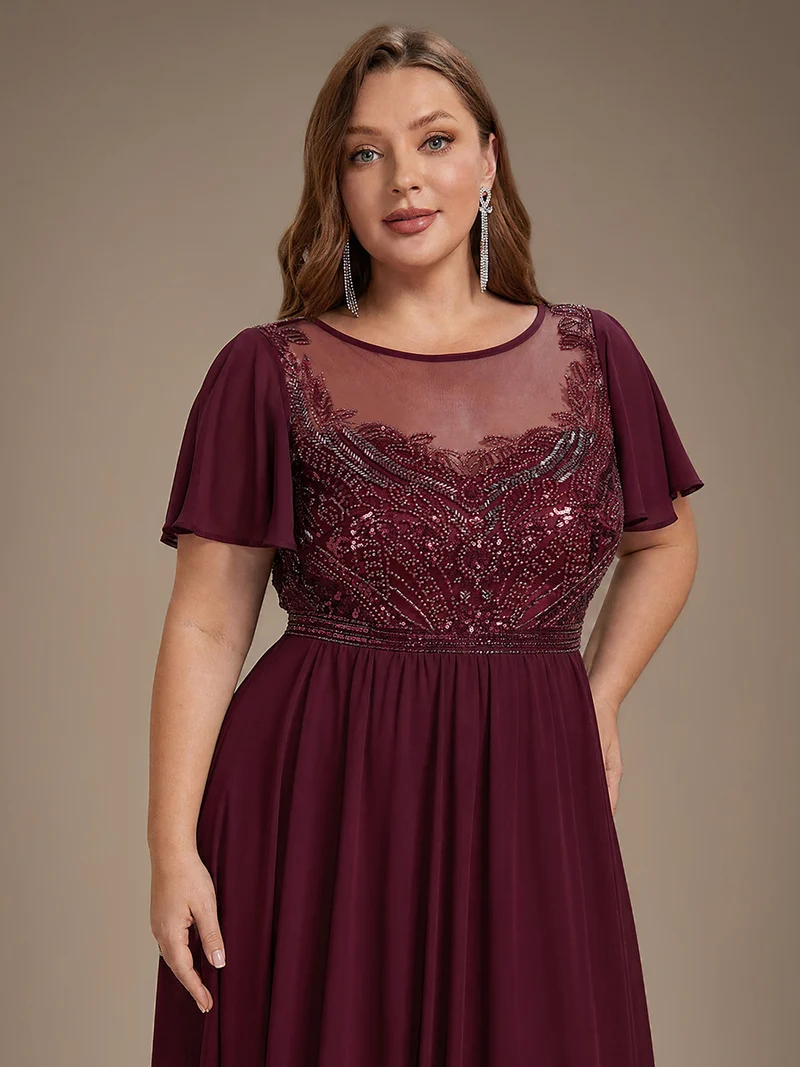 Robe longue en tulle perlée à coupe trapèze et manches volantées