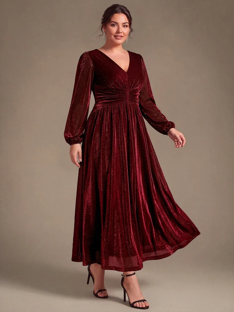 Robe de soirée longue en maille lurex à col V et manches bouffantes