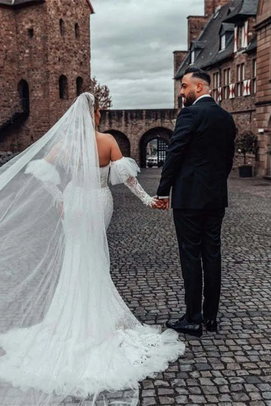 Robe de mariée sirène à col en cœur avec manches bouffantes en dentelle et traîne