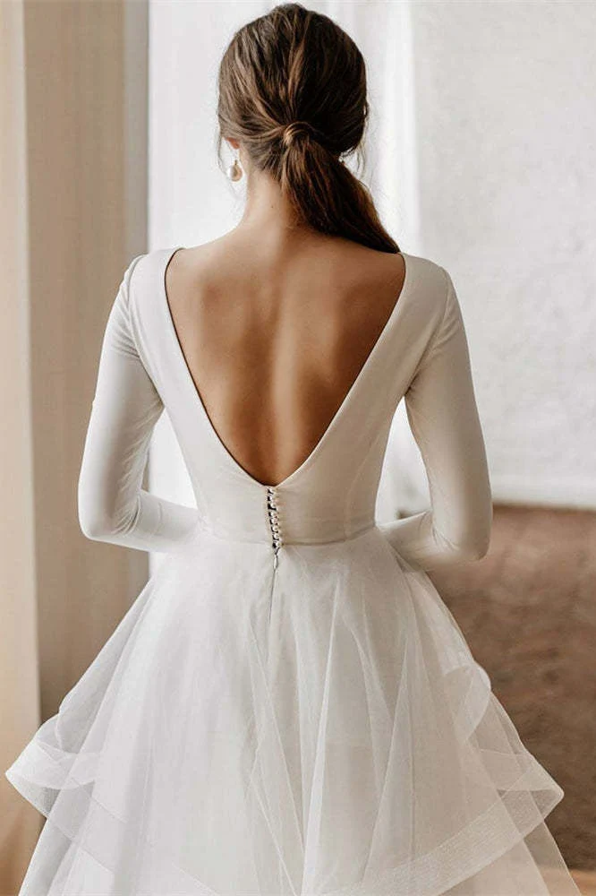 Robe de mariée en tulle à manches longues et décolleté en V avec jupe superposée