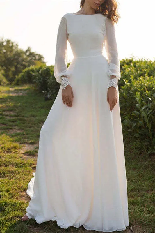 Robe de mariée en mousseline à manches longues et dos nu avec poignets en dentelle