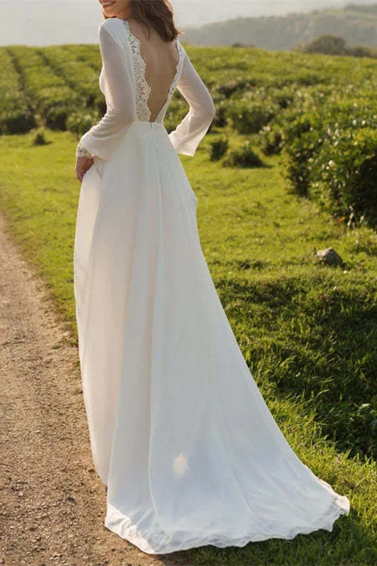 Robe de mariée en mousseline à manches longues et dos nu avec poignets en dentelle