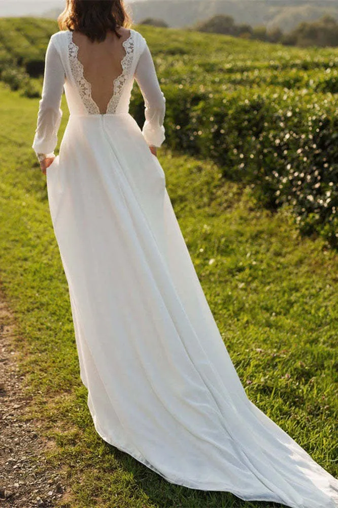 Robe de mariée en mousseline à manches longues et dos nu avec poignets en dentelle