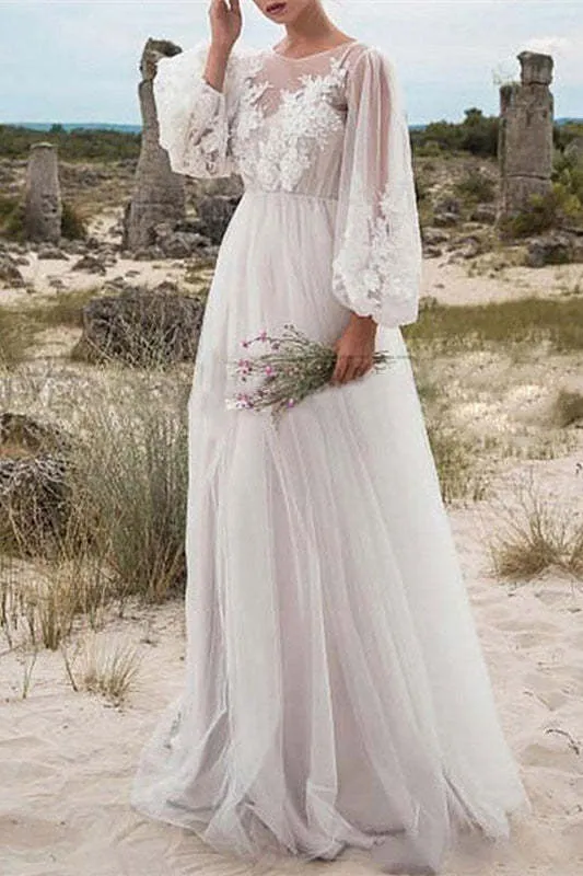 Robe de mariée en tulle et dentelle à manches bouffantes avec corsage transparent