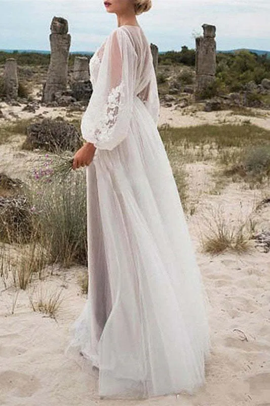 Robe de mariée en tulle et dentelle à manches bouffantes avec corsage transparent