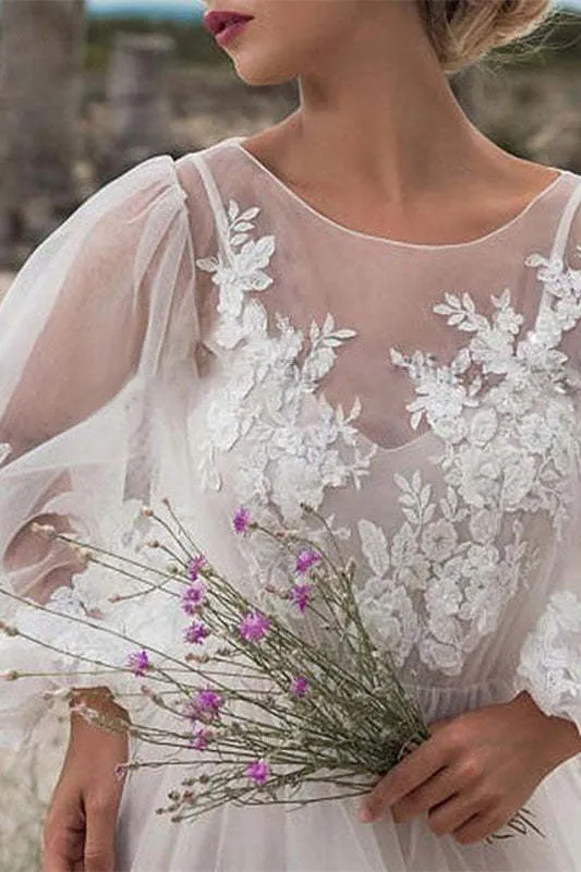 Robe de mariée en tulle et dentelle à manches bouffantes avec corsage transparent