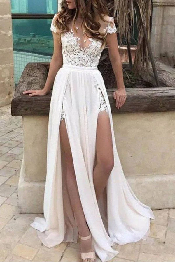 Robe de mariée en dentelle à manches courtes et jupe fluide à fente haute