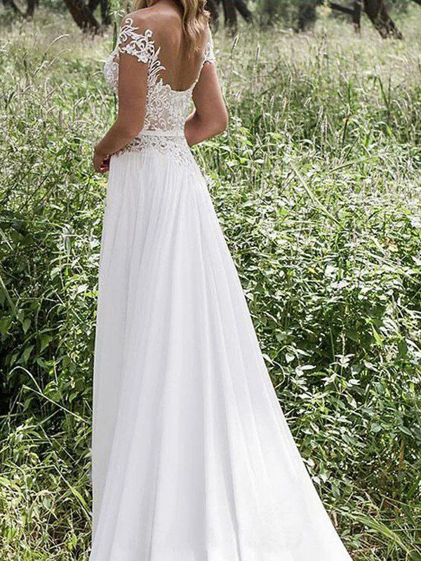 Robe de mariée en dentelle à manches courtes et jupe fluide à fente haute