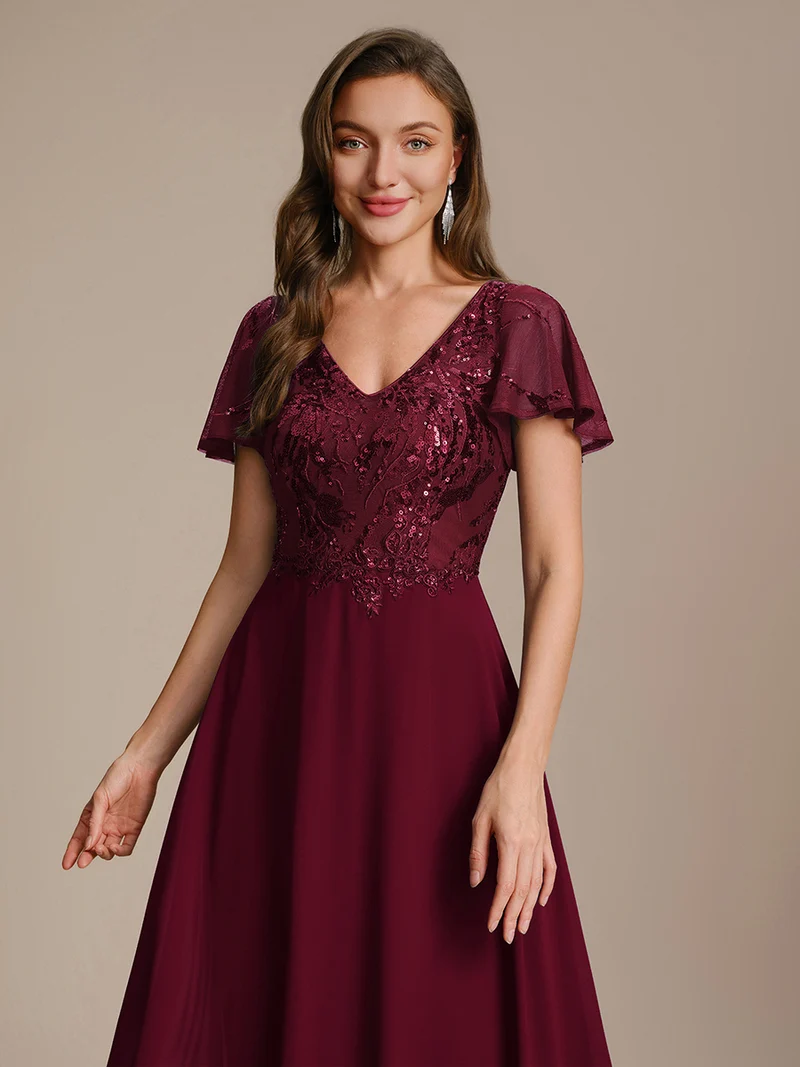 Robe longue stretch col en V avec volants et appliqués
