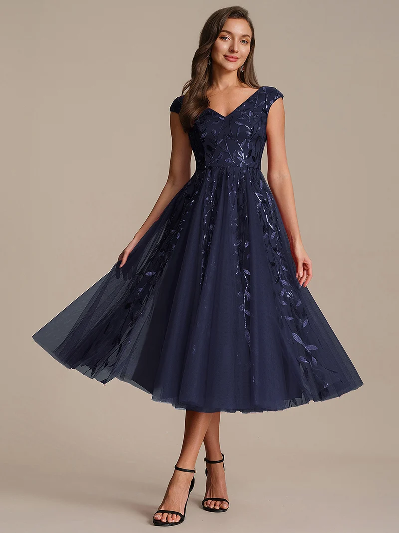 Robe midi sans manches col en V à sequins et coupe évasée