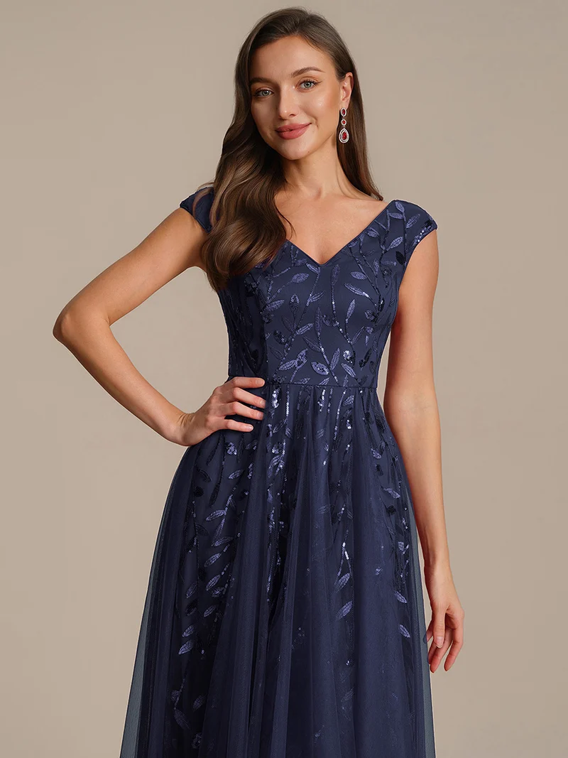 Robe midi sans manches col en V à sequins et coupe évasée