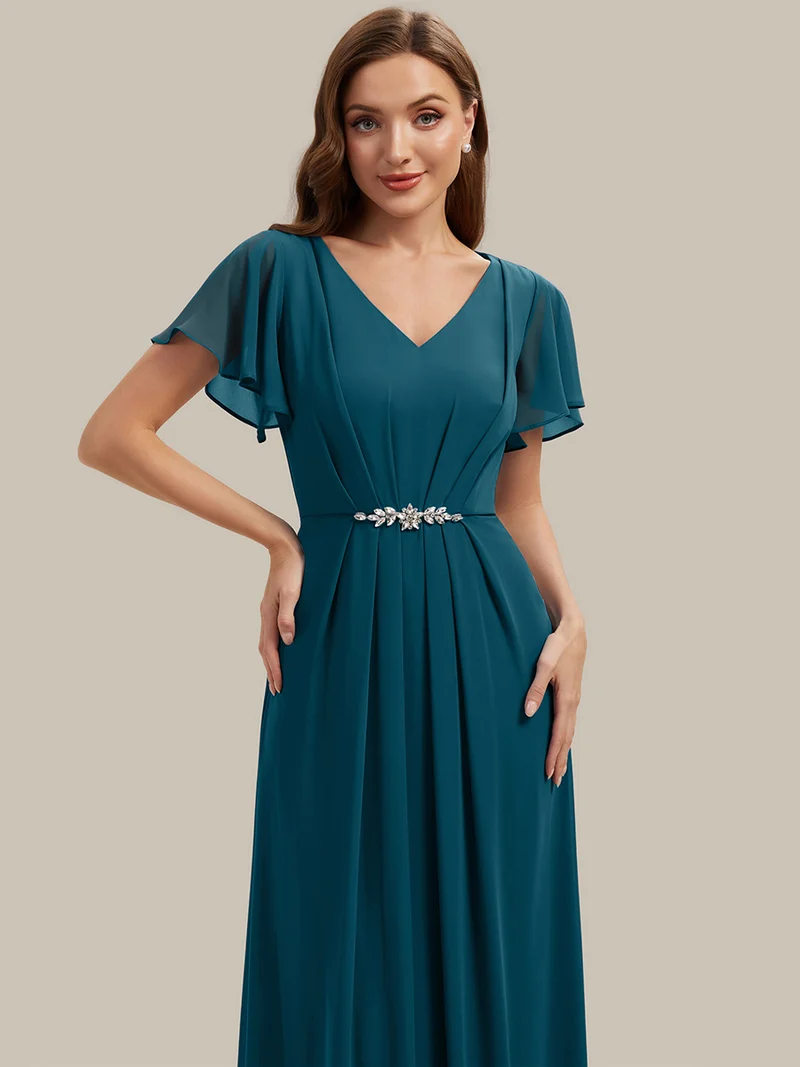 Robe d'invitée à col en V orné de strass et manches à volants
