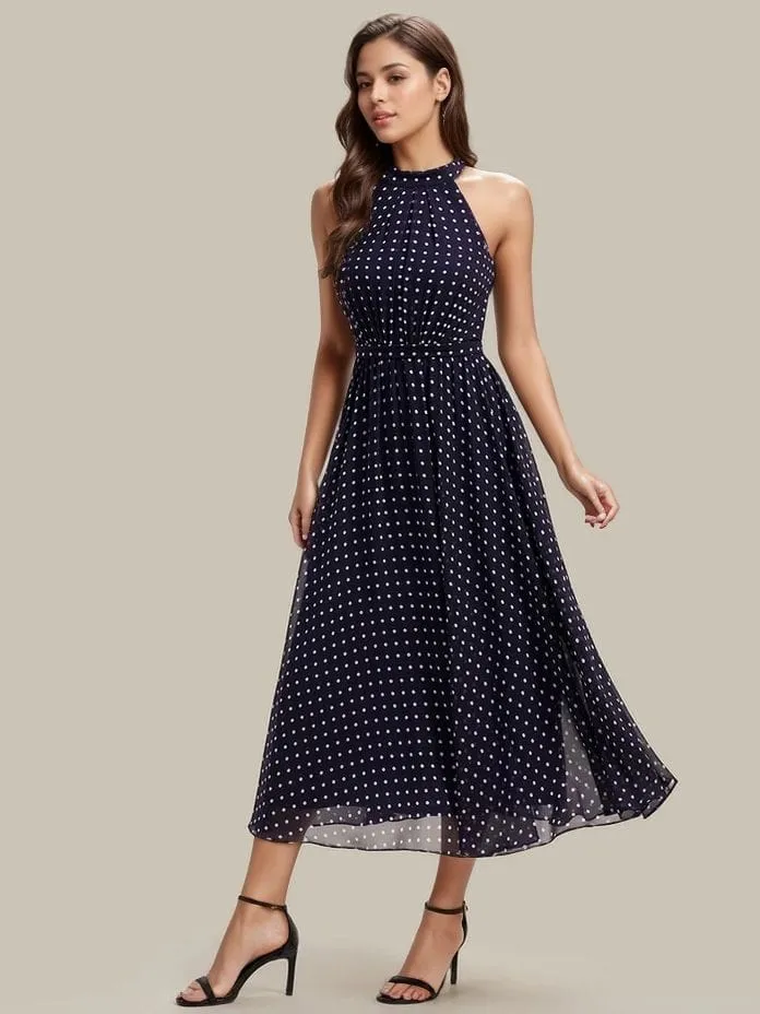 Robe de cocktail bleu marine à pois sans manches col licou