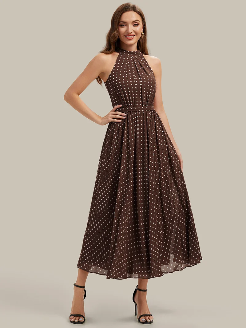 Robe dos nu à pois avec jupe en mousseline