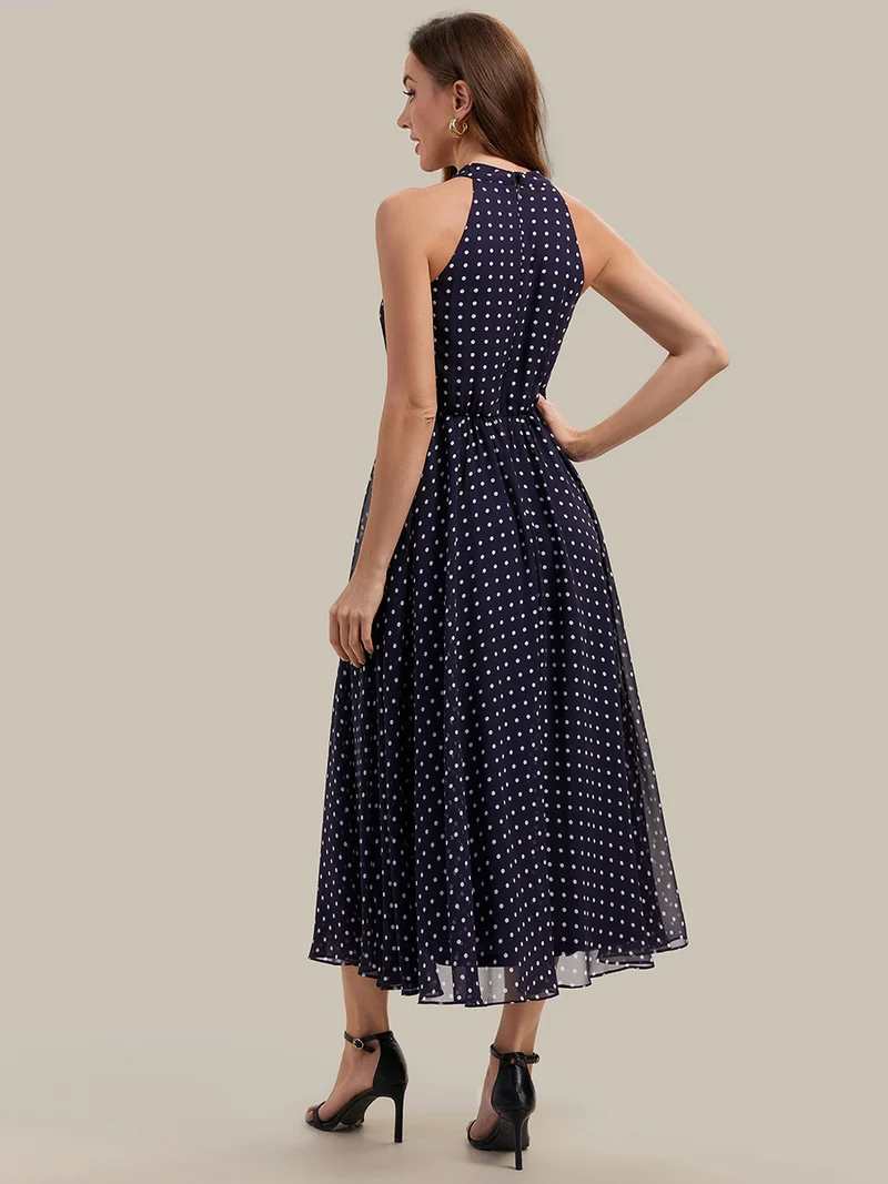 Robe dos nu à pois avec jupe en mousseline