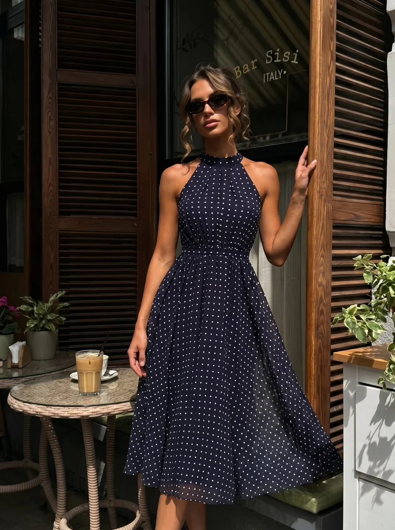 Robe dos nu à pois avec jupe en mousseline