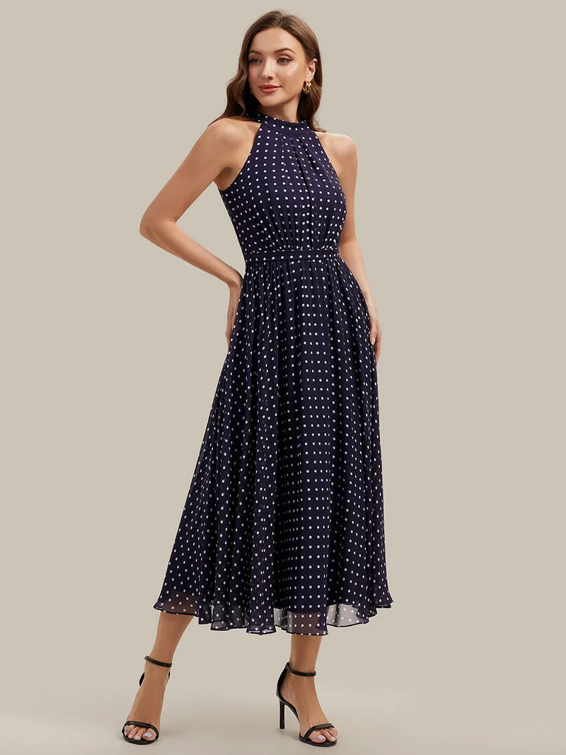 Robe dos nu à pois avec jupe en mousseline