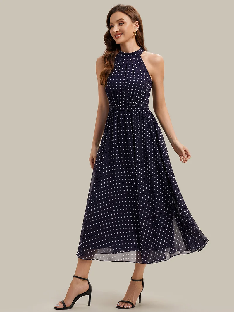 Robe dos nu à pois avec jupe en mousseline