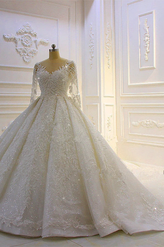 Robe de mariée élégante à manches longues avec appliques en dentelle perlée et traîne