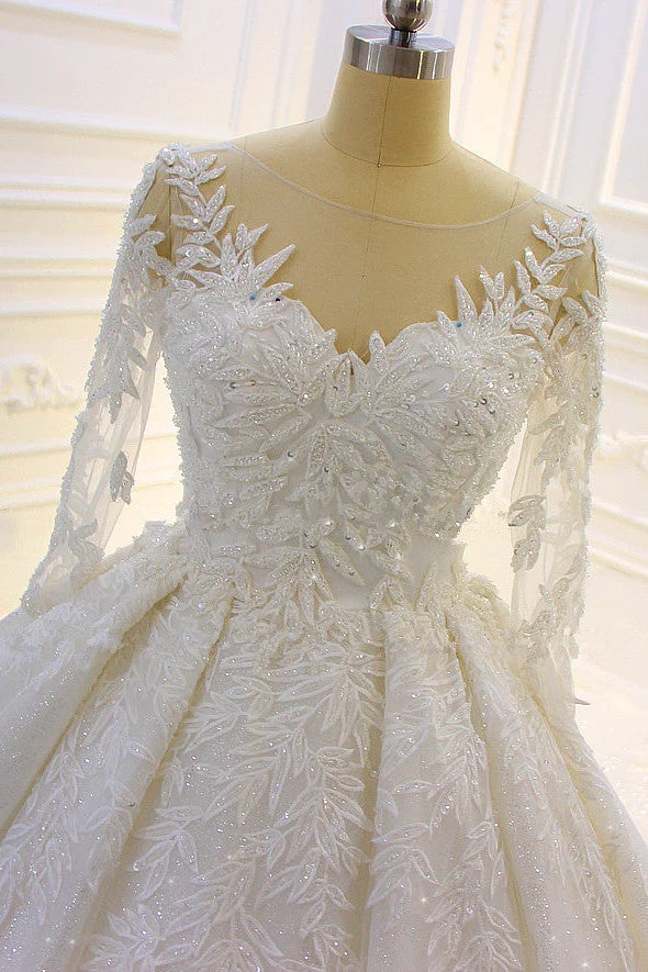 Robe de mariée élégante à manches longues avec appliques en dentelle perlée et traîne