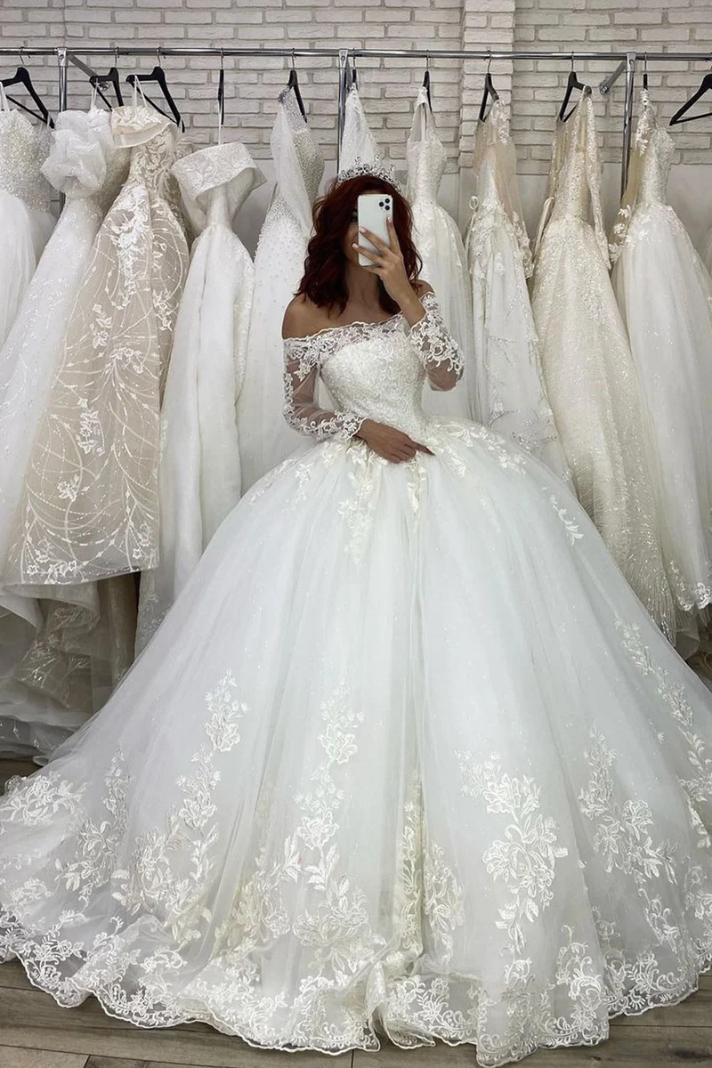 Robe de mariée élégante à épaules dénudées et manches longues, effet illusion, avec appliques