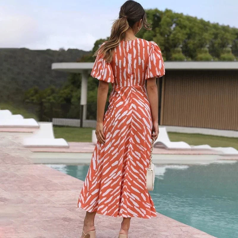 Robe de cocktail orange midi manches bouffantes