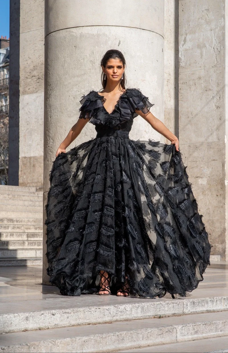 Robe longue défilé à plumetis noir