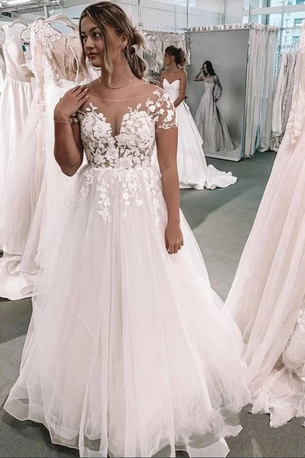 Robe de mariée trapèze à manches courtes et col bateau avec appliques en dentelle et tulle