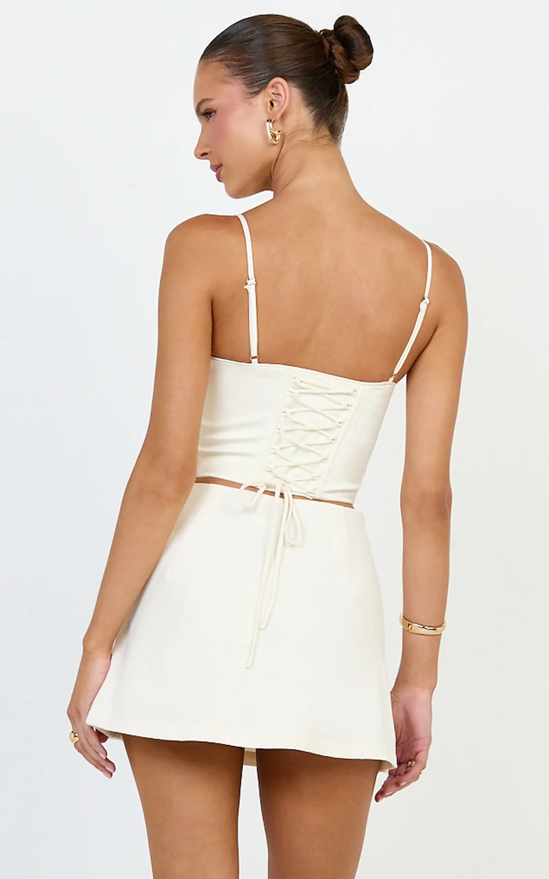 Quilla Mini Skirt - Mid Waist Faux Button Front Skirt in Cream