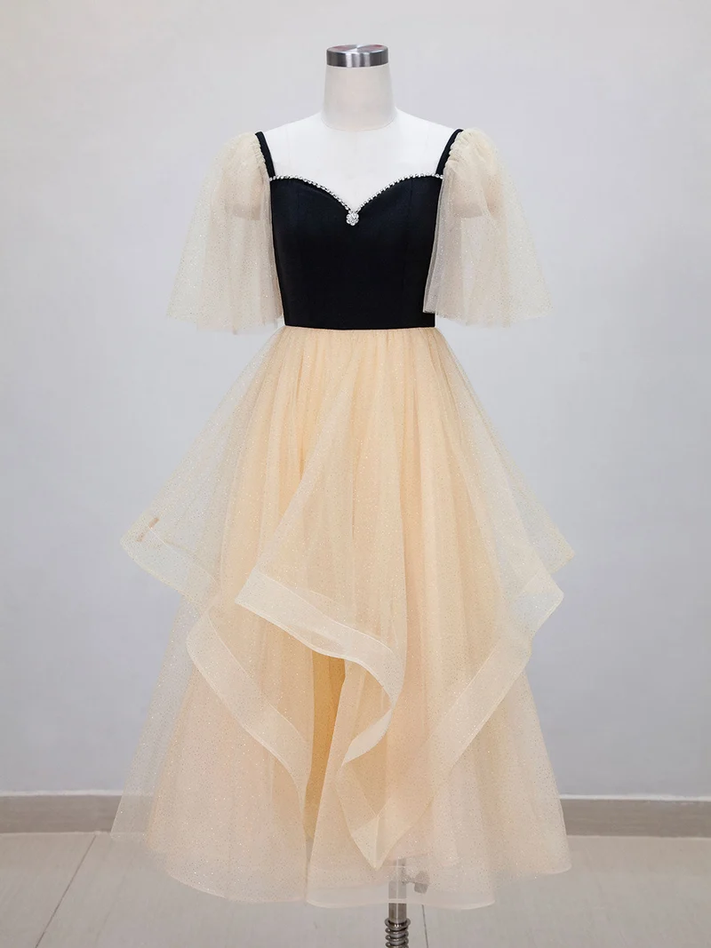Robe de bal noire avec haut et bas champagne, longueur thé