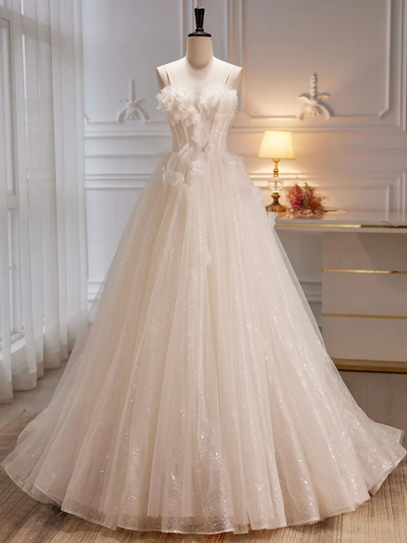 Robe de mariée ivoire transparente à bretelles spaghetti