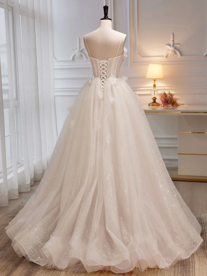 Robe de mariée ivoire transparente à bretelles spaghetti