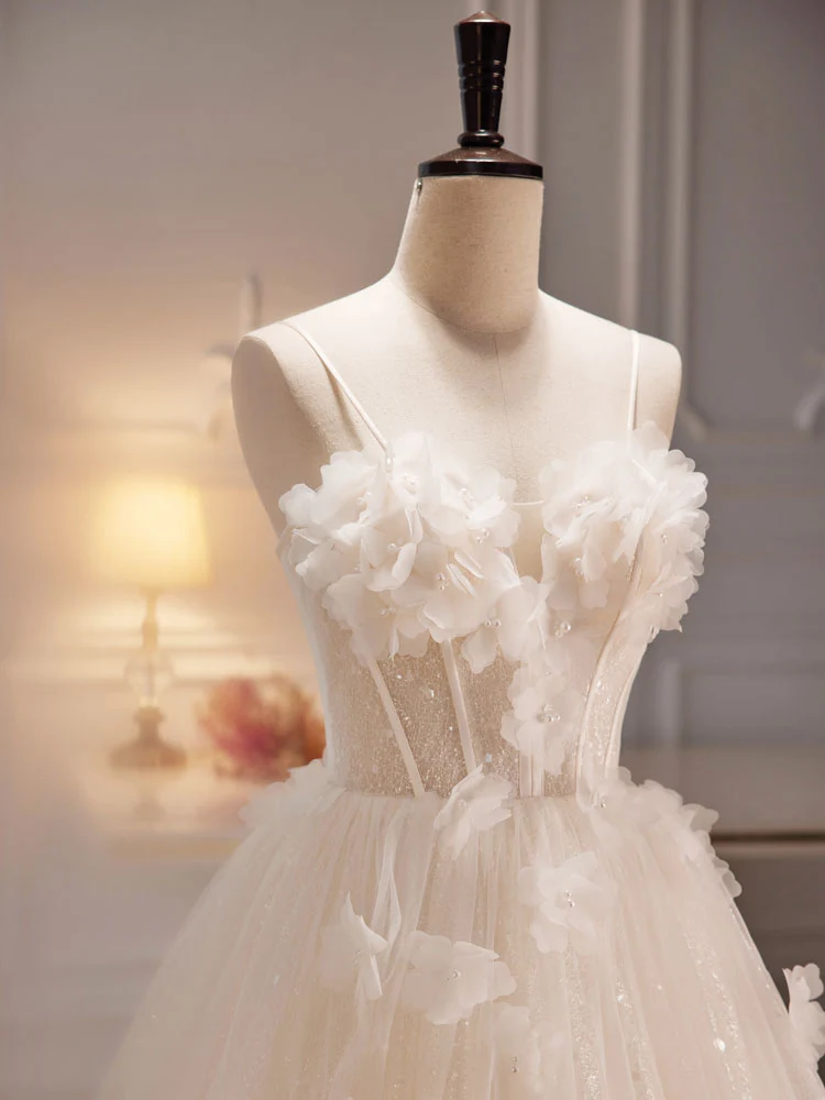 Robe de mariée ivoire transparente à bretelles spaghetti