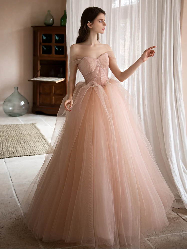 Robe de mariée en tulle rose poussiéreux