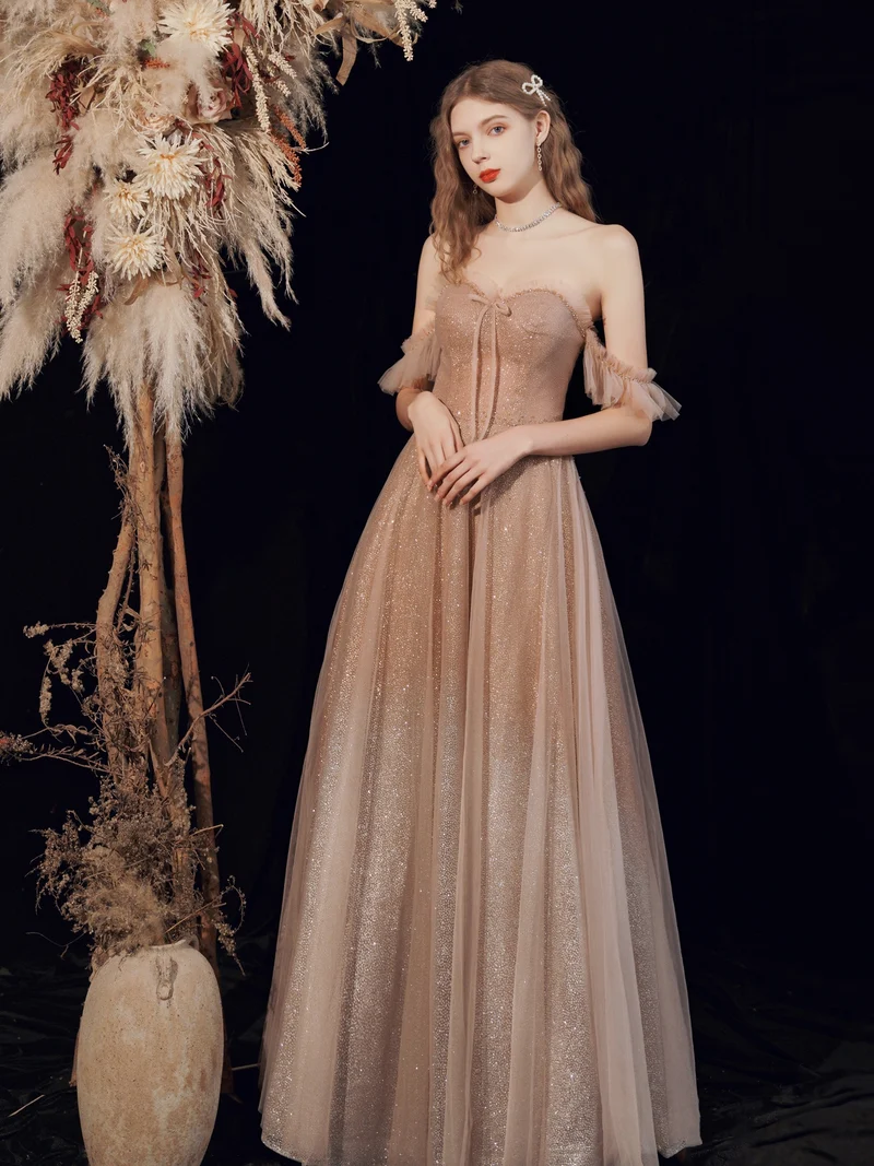 Robe de bal longue à paillettes champagne scintillantes