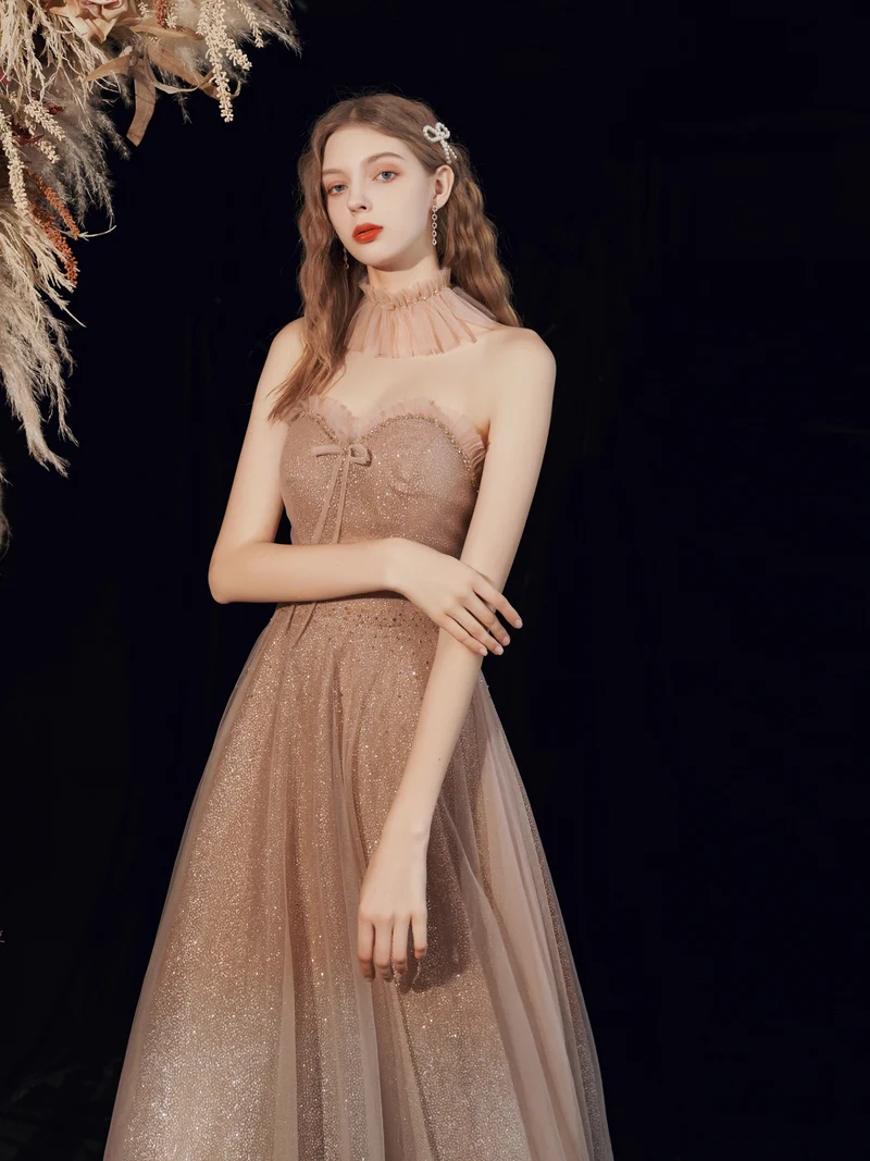 Robe de bal longue à paillettes champagne scintillantes