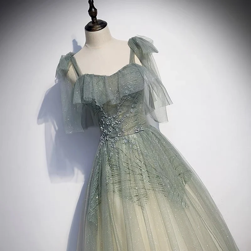 Robe de bal en tulle vert sauge dégradé de paillettes