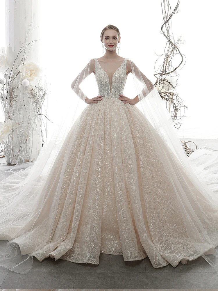 Robe de mariée robe de bal sans manches à col en V et paillettes champagne clair