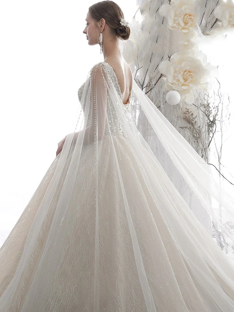 Robe de mariée robe de bal sans manches à col en V et paillettes champagne clair