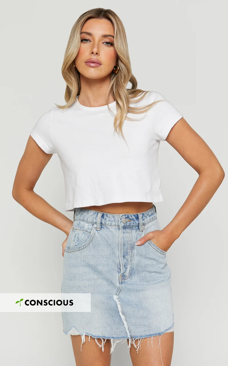 Pieta Mini Skirt - Recycled Cotton Raw Hem Denim Skirt in Mid Blue Wash