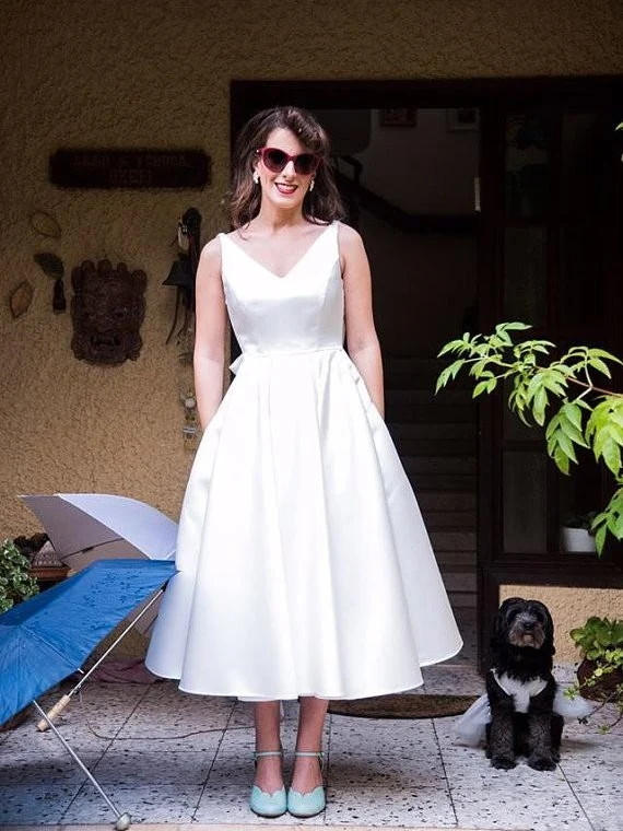 Robe de mariée vintage à col en V et longueur thé des années 50 avec poches